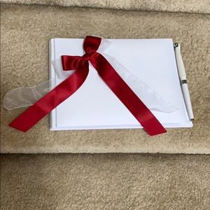 Wedding guest book with pen and ring bearer pillow